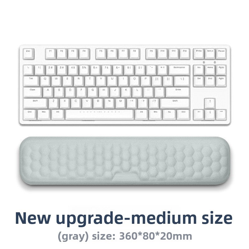 Deskfriend Wrist Support Pad in use supporting a wrist at the keyboard
