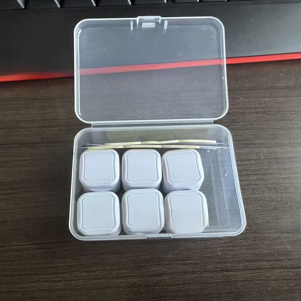 Deskfriend Magnetic Cable Clips holding a charging cable upright on a desk